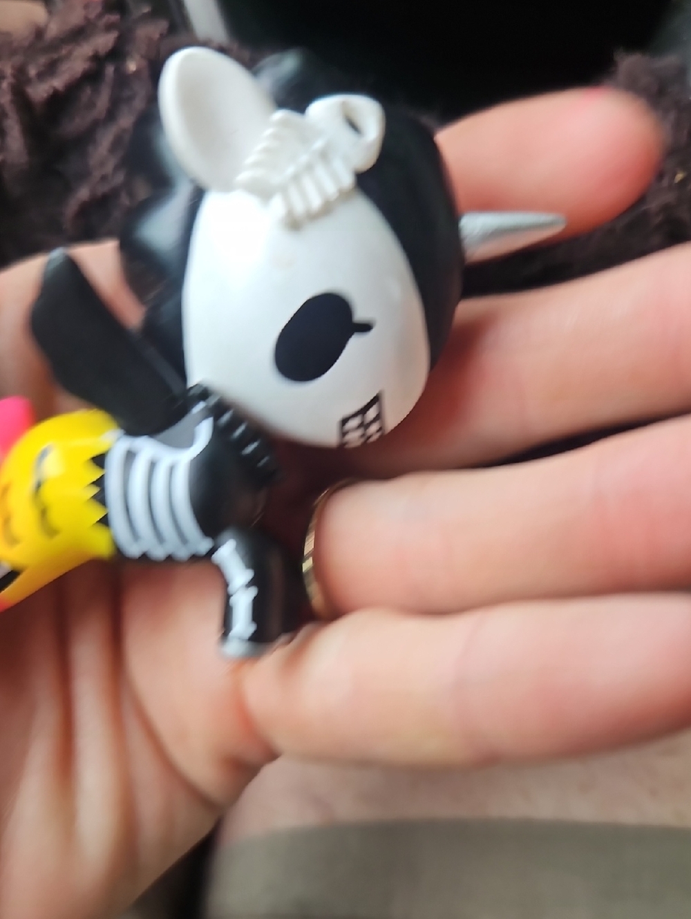 Black & White Skeleton Unicorn Vinyl Figurine with Yellow Accent